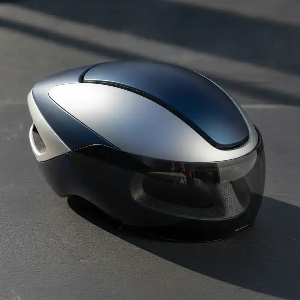 Aero-dynamic cycling helmet displayed on dark background